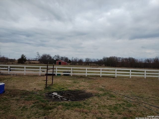 view of yard with a rural view