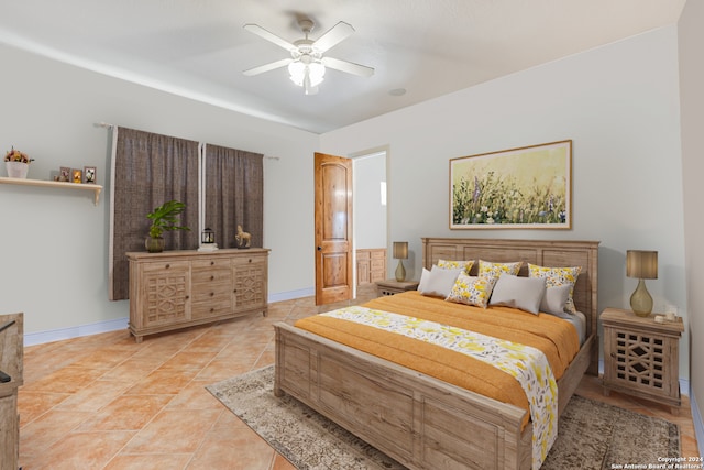 bedroom with light tile floors and ceiling fan