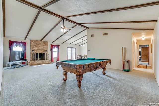 rec room featuring pool table, a fireplace, brick wall, light carpet, and beam ceiling