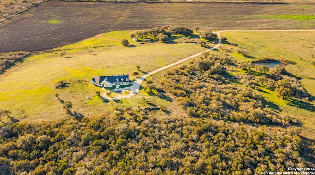 birds eye view of property with a rural view