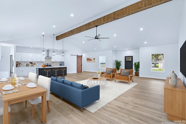 living room featuring high vaulted ceiling, ceiling fan, light wood-type flooring, and beamed ceiling