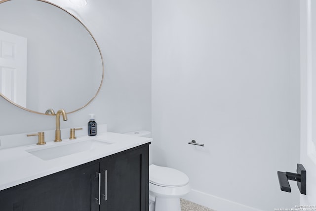 bathroom with tile flooring, large vanity, and toilet