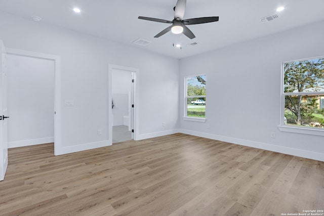 unfurnished room featuring ceiling fan and light wood-type flooring