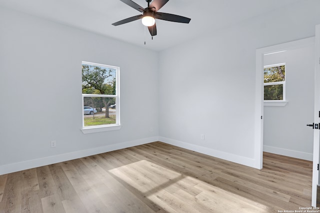 unfurnished room with ceiling fan and light hardwood / wood-style flooring