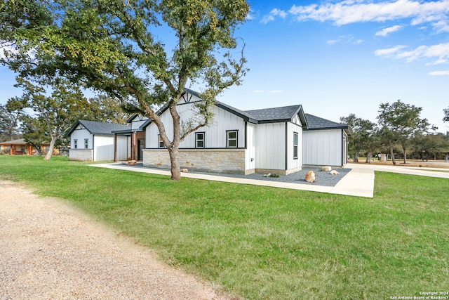 modern farmhouse with a front yard