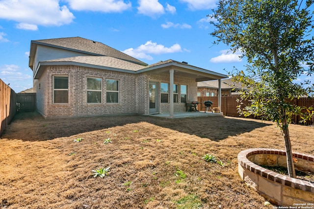 rear view of house with a patio