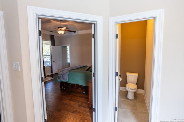 interior space with ornamental molding and dark wood-type flooring