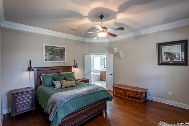 bedroom featuring crown molding, dark hardwood / wood-style floors, ensuite bathroom, and ceiling fan