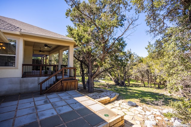 view of patio featuring ceiling fan