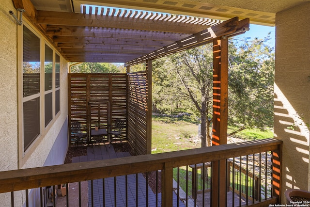 wooden deck featuring a pergola