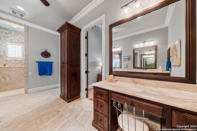 bathroom with vanity, tile flooring, crown molding, and ceiling fan