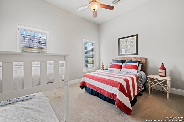 carpeted bedroom featuring ceiling fan