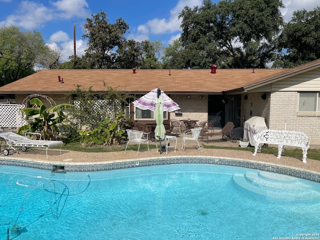 view of pool with a patio area