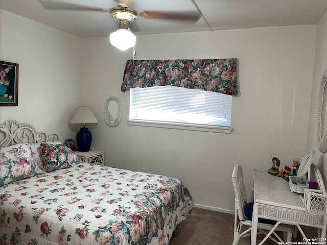 bedroom with dark carpet and ceiling fan