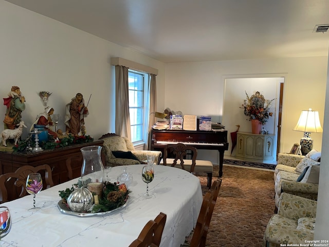 dining room with dark carpet