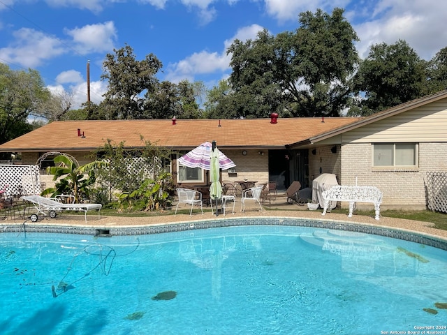 view of pool with a patio