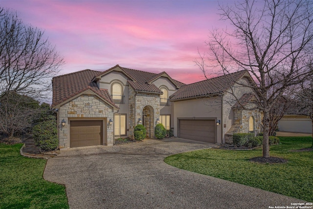 view of front of home with a lawn