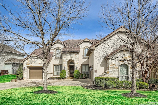 view of front of home with a front lawn and a garage