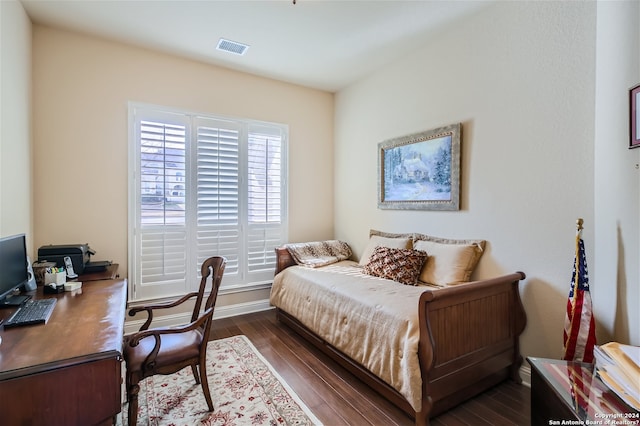 bedroom featuring dark hardwood / wood-style floors