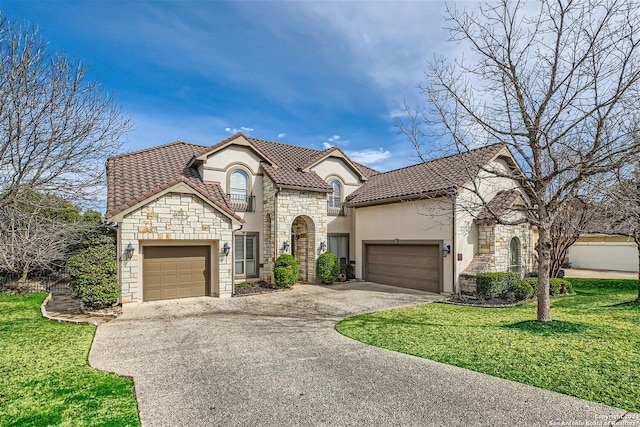 mediterranean / spanish home featuring a front yard