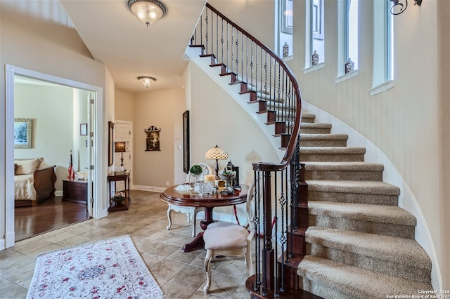 stairway featuring light hardwood / wood-style floors