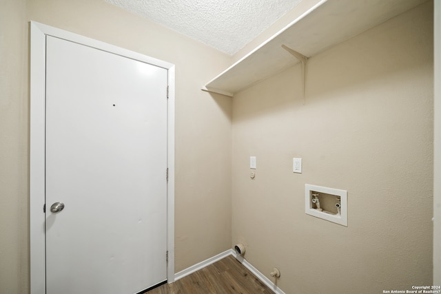 laundry area with dark hardwood / wood-style floors, washer hookup, a textured ceiling, and hookup for a gas dryer