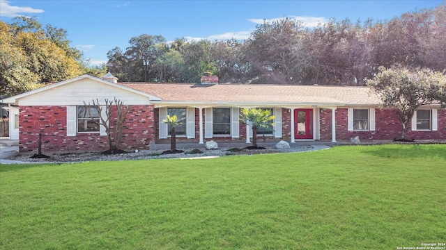 ranch-style house featuring a front lawn