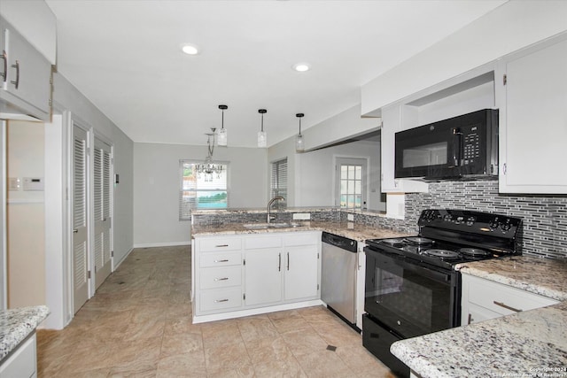 kitchen featuring white cabinets, hanging light fixtures, kitchen peninsula, and black appliances