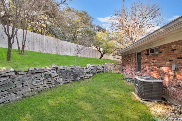 view of yard featuring central AC unit