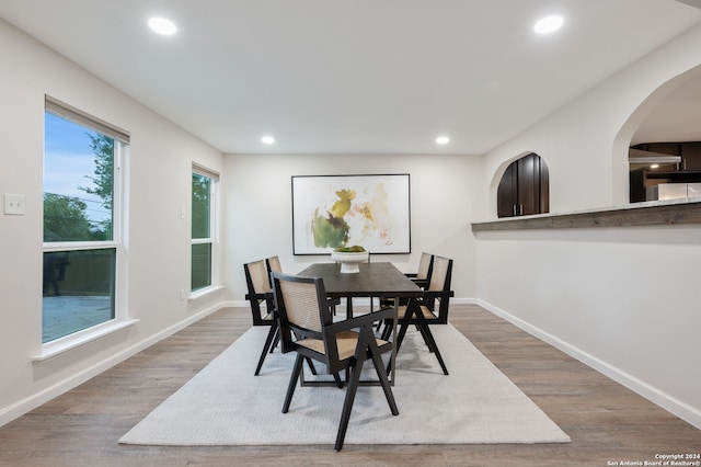 dining space with hardwood / wood-style floors