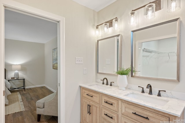 bathroom featuring vanity and hardwood / wood-style floors