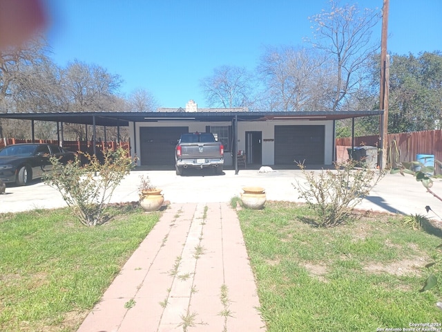 view of front facade with a front yard and a garage