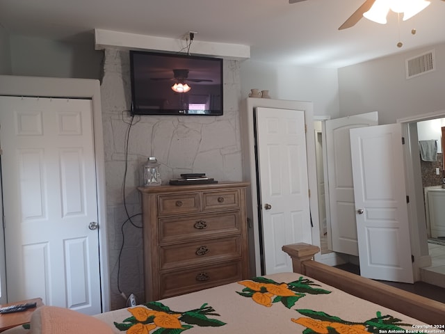 bedroom with ceiling fan and ensuite bath