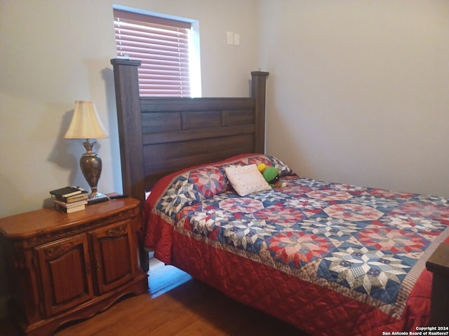 bedroom featuring wood-type flooring