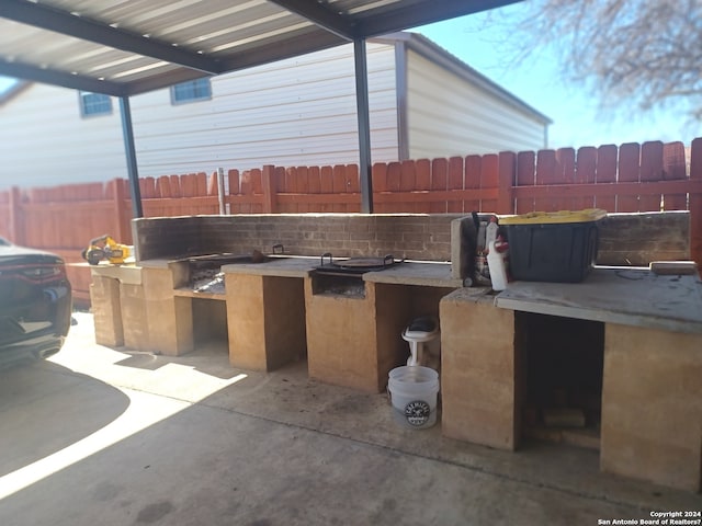 view of patio / terrace featuring exterior kitchen