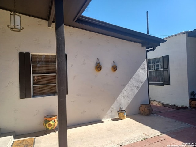 view of property exterior featuring a patio