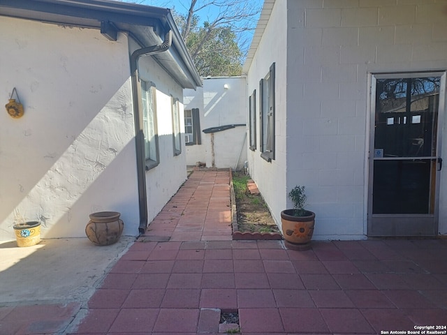 view of side of property featuring a patio area