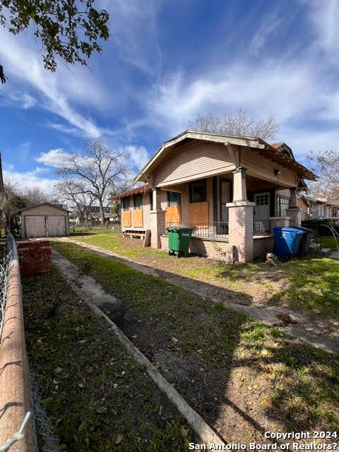 view of side of property featuring a porch