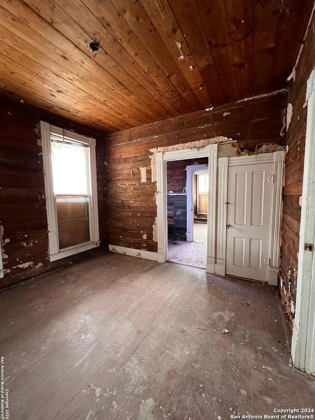 miscellaneous room featuring dark hardwood / wood-style floors, wooden walls, and wood ceiling