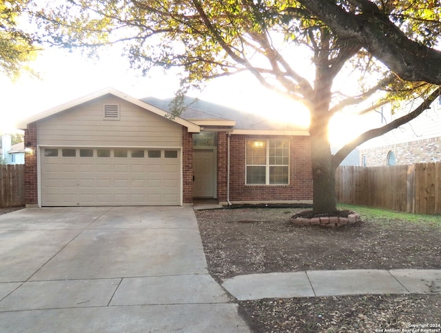 single story home featuring a garage