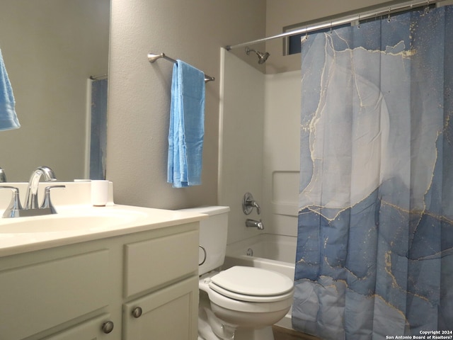 full bathroom featuring toilet, vanity, and shower / bath combo with shower curtain