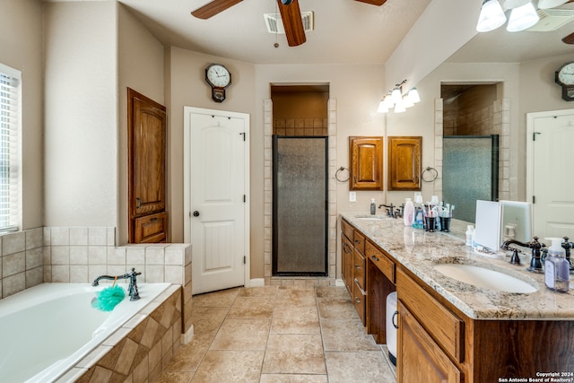 bathroom featuring ceiling fan, tile flooring, double vanity, and independent shower and bath