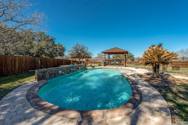 view of swimming pool featuring pool water feature and a gazebo