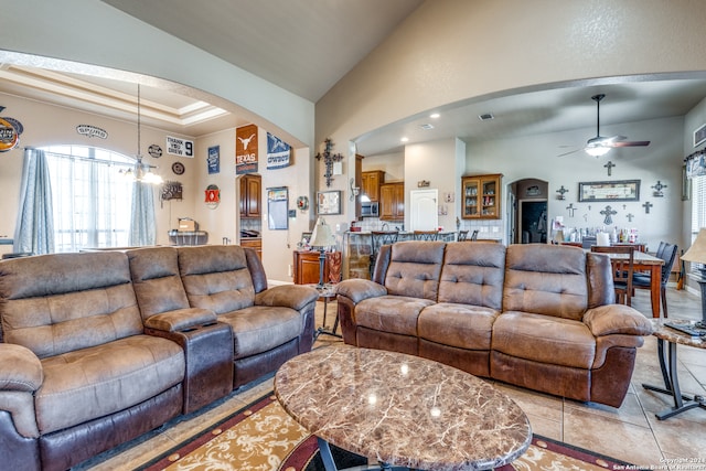 living room featuring high vaulted ceiling, ceiling fan, and light tile floors