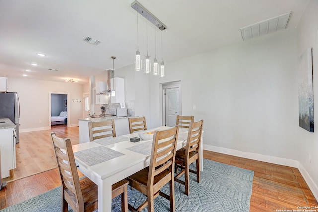 dining room with light hardwood / wood-style flooring