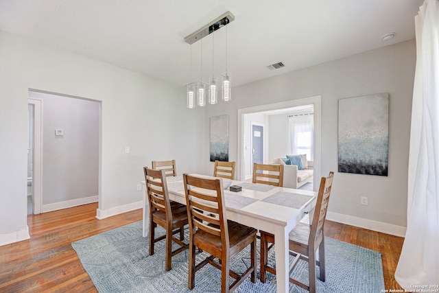 dining area featuring hardwood / wood-style flooring