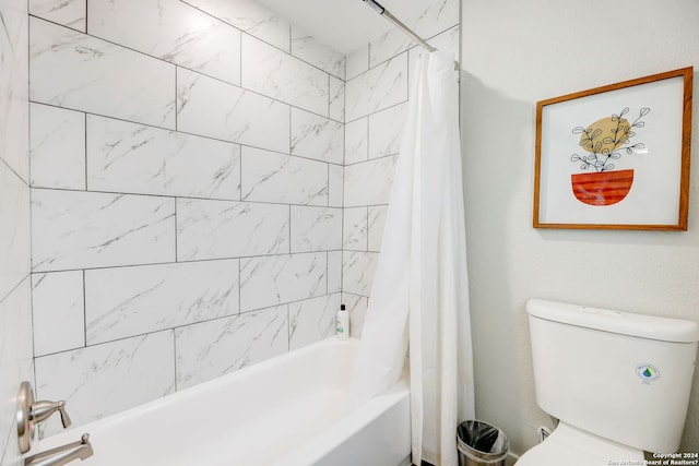 bathroom featuring toilet and shower / bathtub combination with curtain