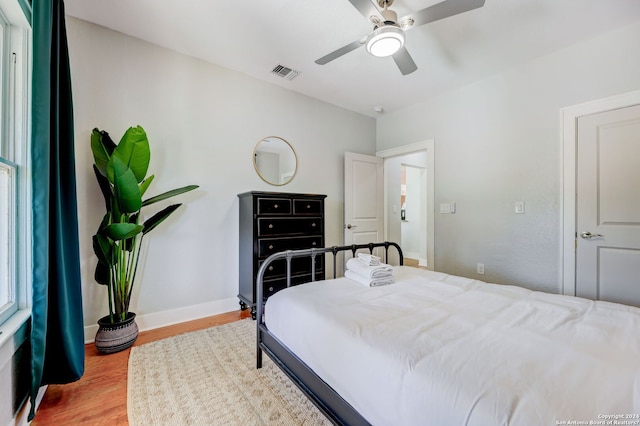 bedroom featuring light hardwood / wood-style floors and ceiling fan