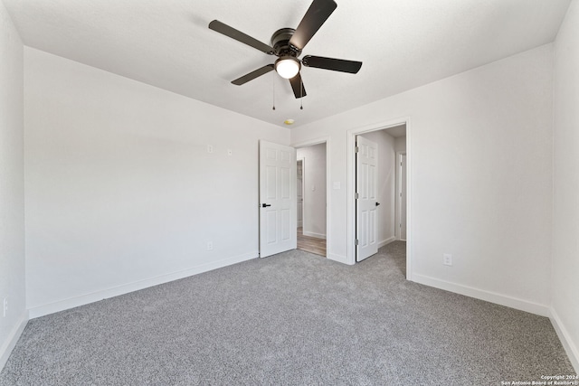 unfurnished bedroom featuring ceiling fan and light colored carpet