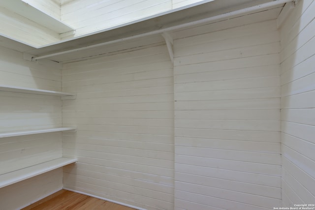 spacious closet with light hardwood / wood-style floors